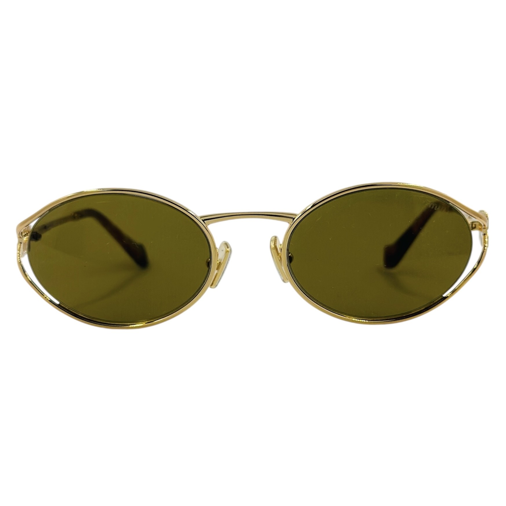 MIUMIUSMU52Y7OE-01T1 gafas monturas sol mium iu smu52y ovalado redondo dorado marron uniforme optica hermo optica diagonal optica toscana optica gran via vytria