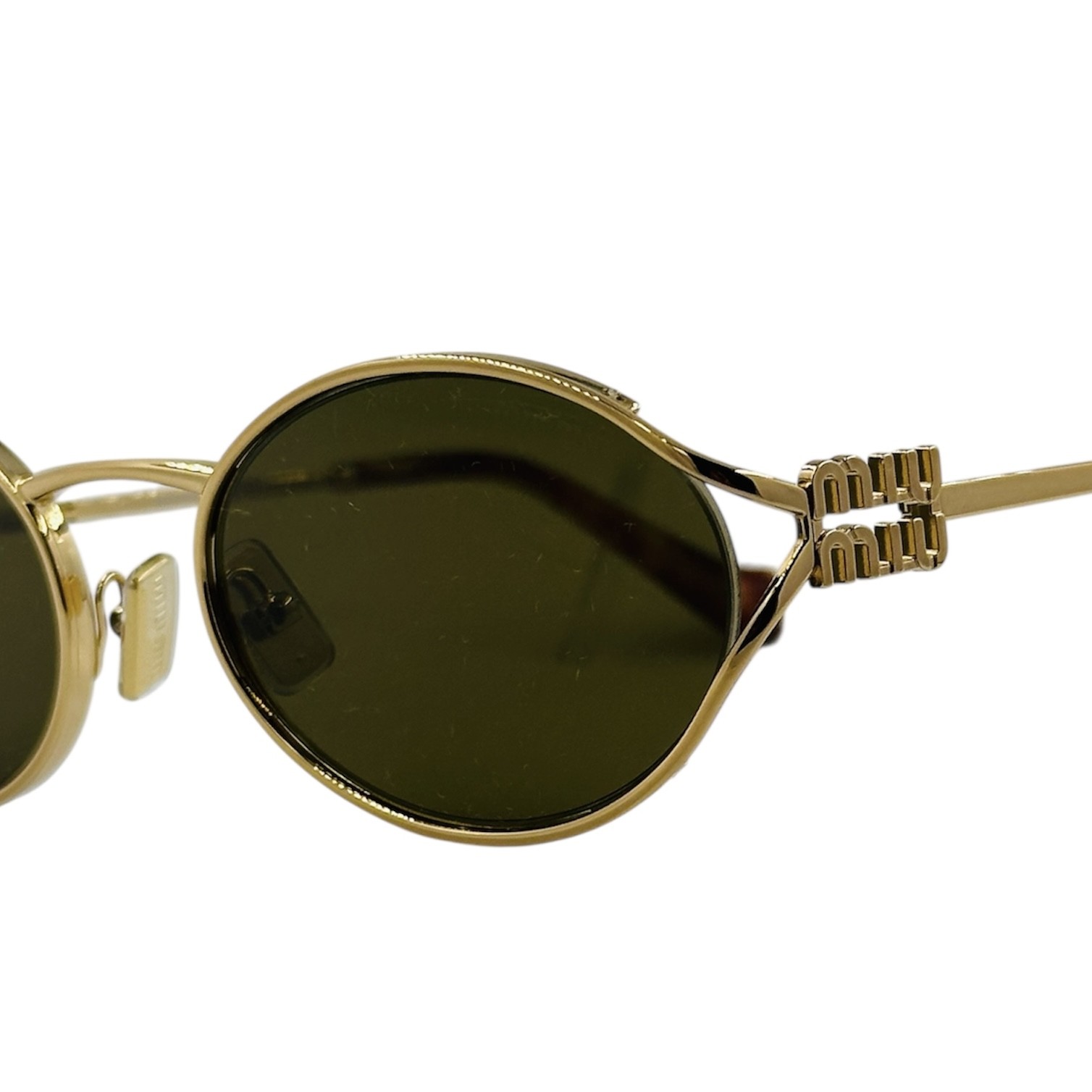 MIUMIUSMU52Y7OE-01T3 gafas monturas sol mium iu smu52y ovalado redondo dorado marron uniforme optica hermo optica diagonal optica toscana optica gran via vytria